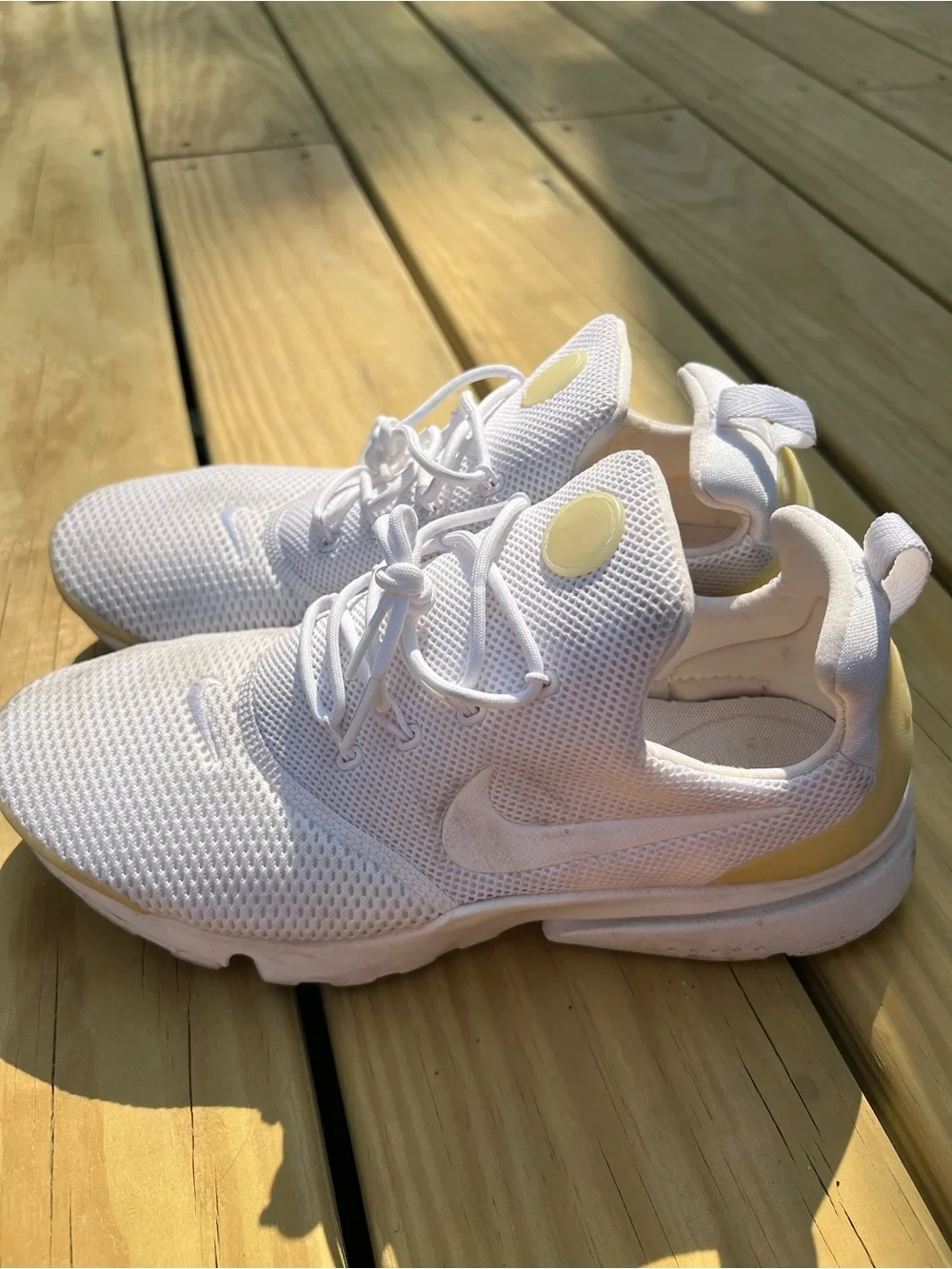 Nike Women’s White Mesh Sneakers with Cream Accents.